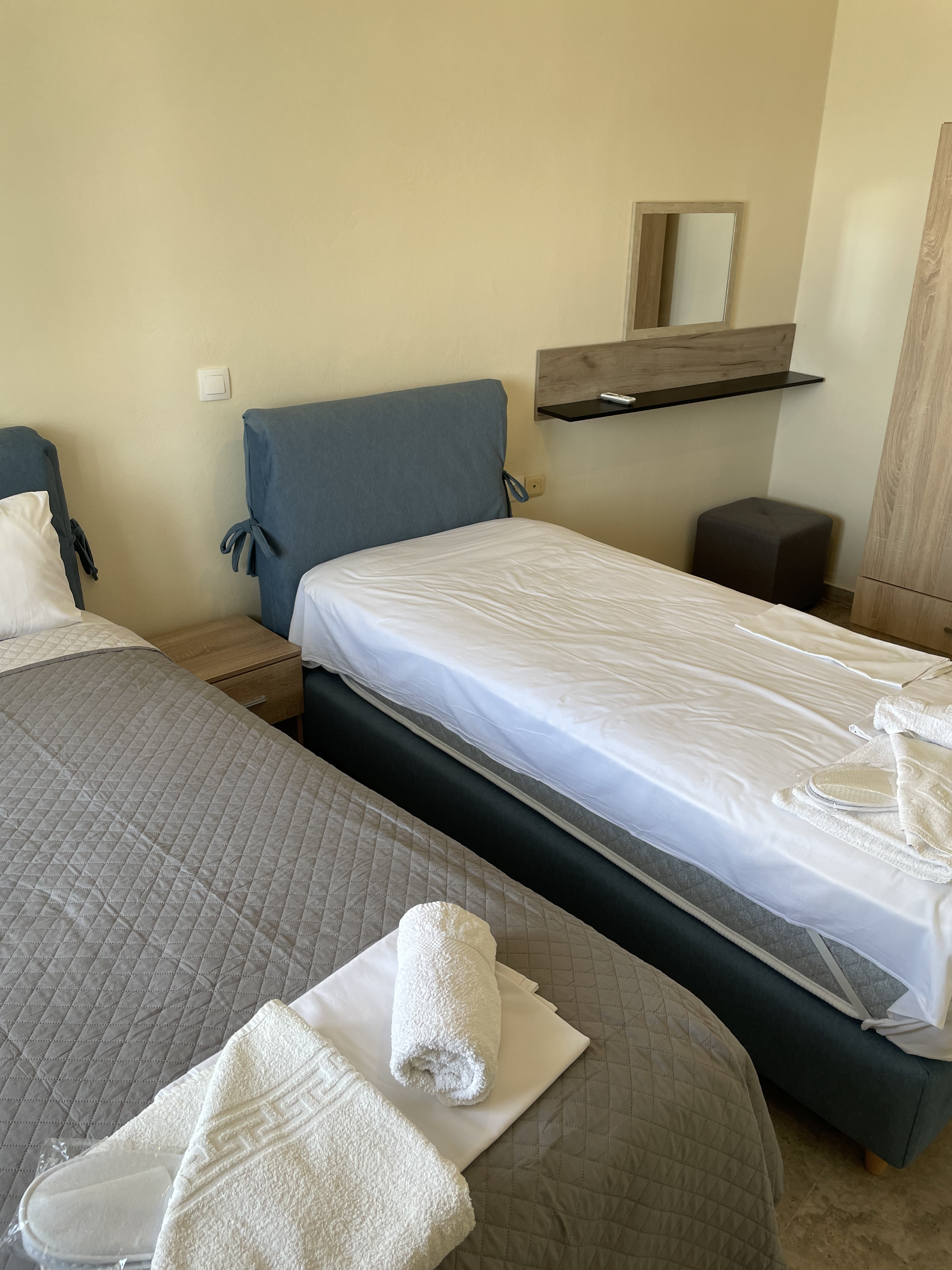 Twin bedroom with blue headboards