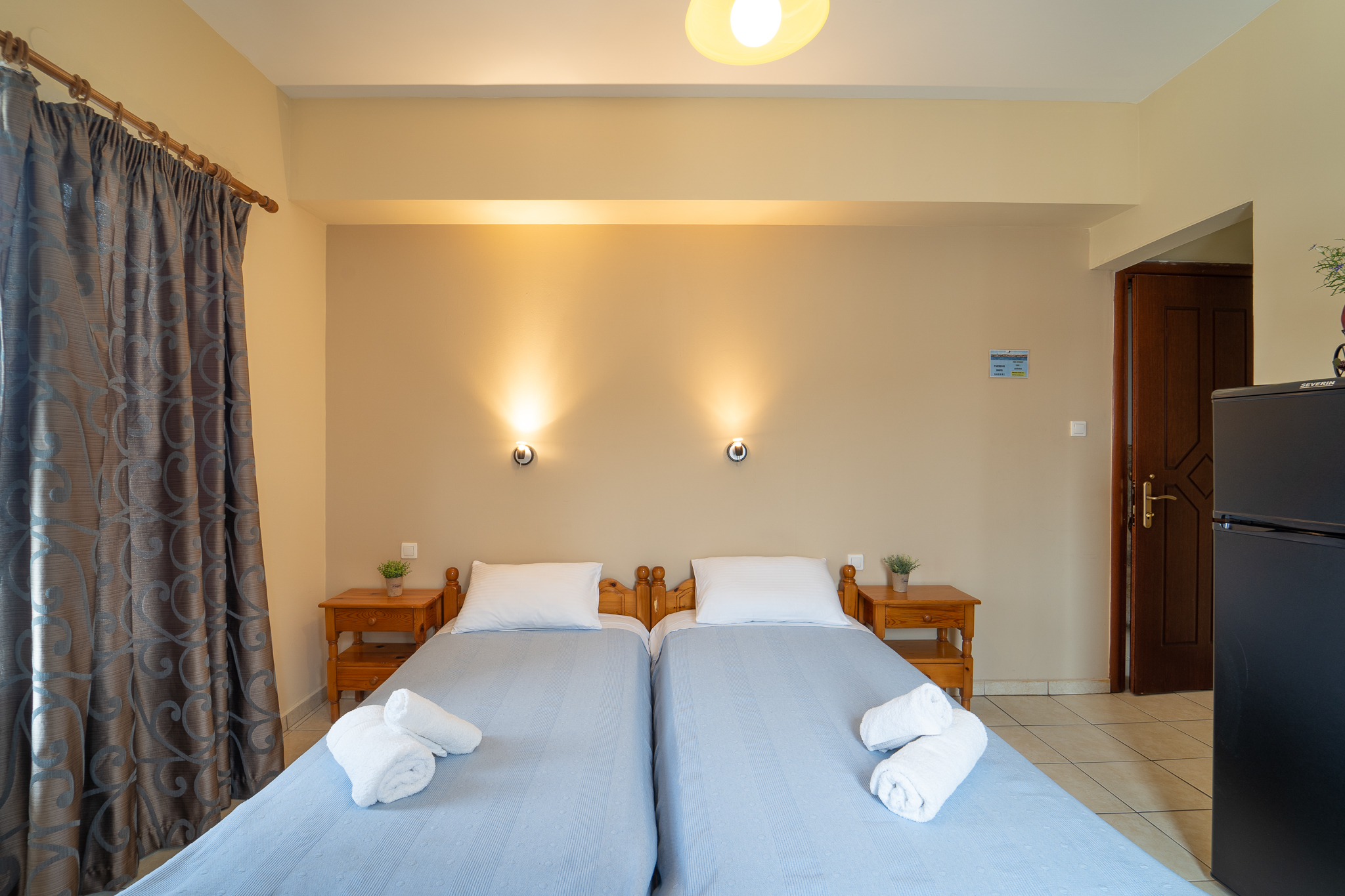 Twin room with warm lighting